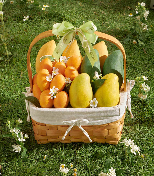 Premium Thai mango and tropical fruit gift basket with hand-woven wicker and fresh white blooms