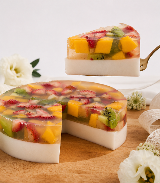 Charlotte Bakery's artisan Sunshine Fruit Coconut Jelly Cake, a vibrant round dessert