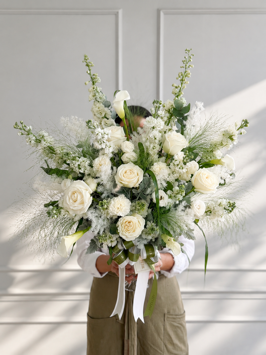 Elegant, premium white rose and calla lily arrangement by Flowers by