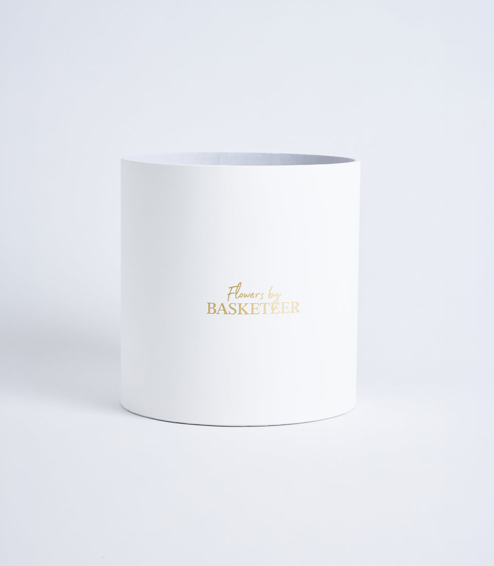 Mist grey cylindrical flower gift box with gold Basketeer logo, luxury premium packaging for fresh flowers