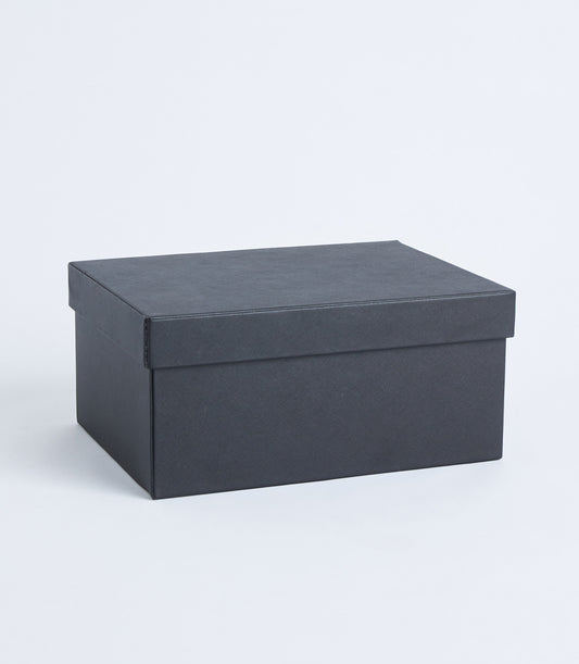 Black leather storage box with refined crosshatch texture and fitted lid for luxury gifting