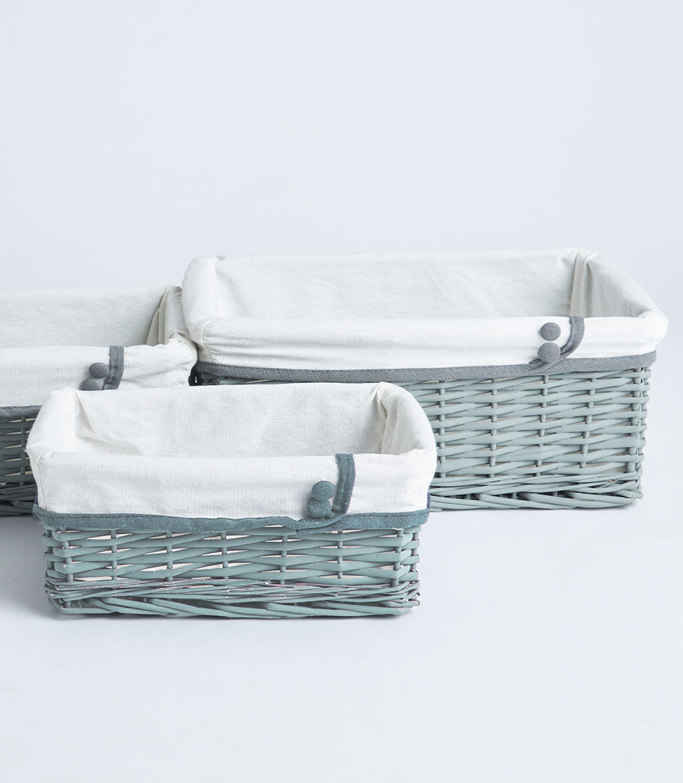 Basketeer's elegant set of three rectangular wicker baskets, in a