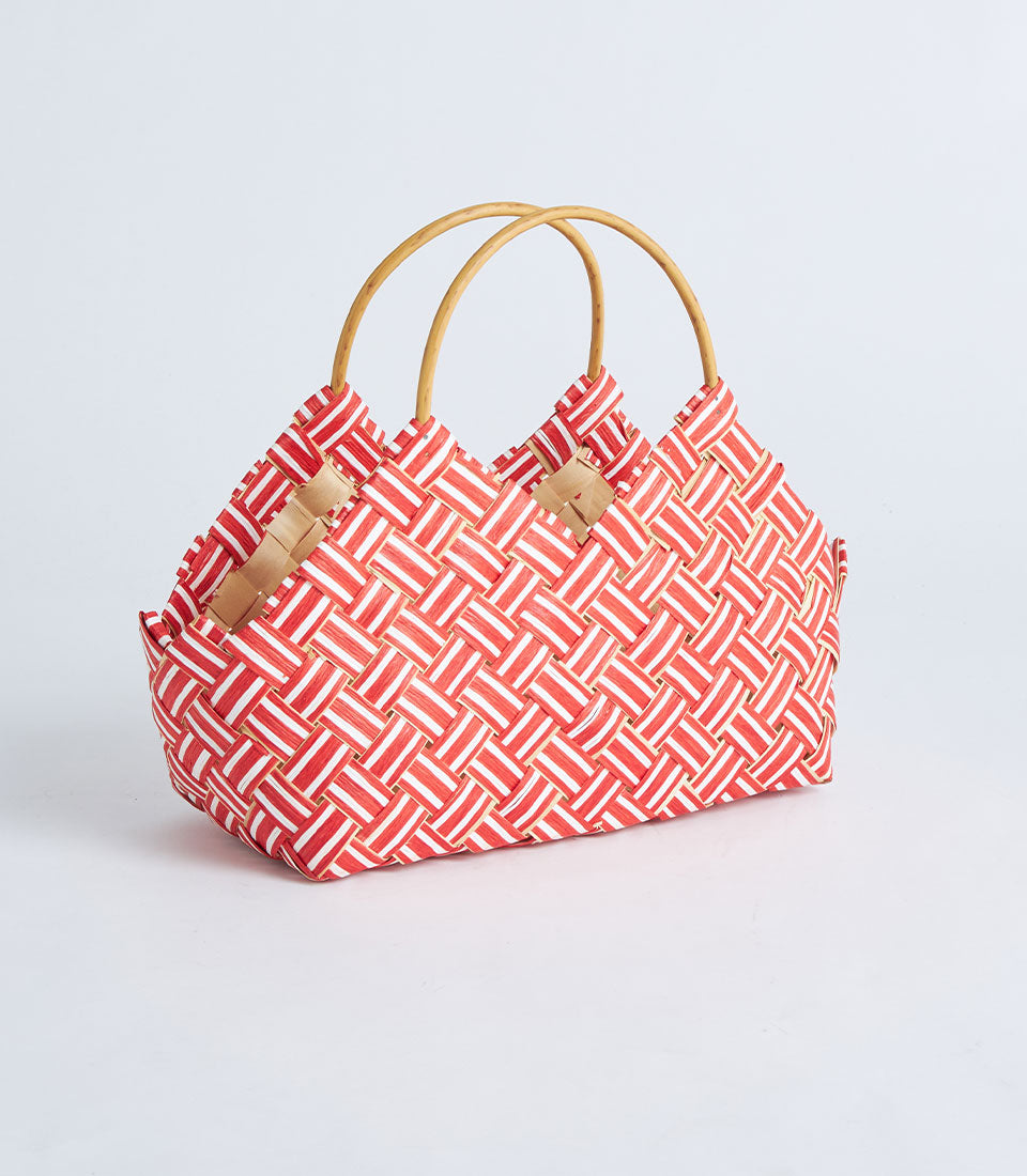 Red and white woven gift basket with curved handles and geometric checkerboard pattern