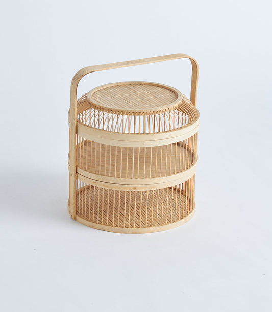 Natural bamboo tiered food carrier with woven handle, handcrafted for artisan gifting