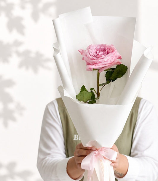 A single, elegant pink rose bouquet from Flowers by Basketeer,