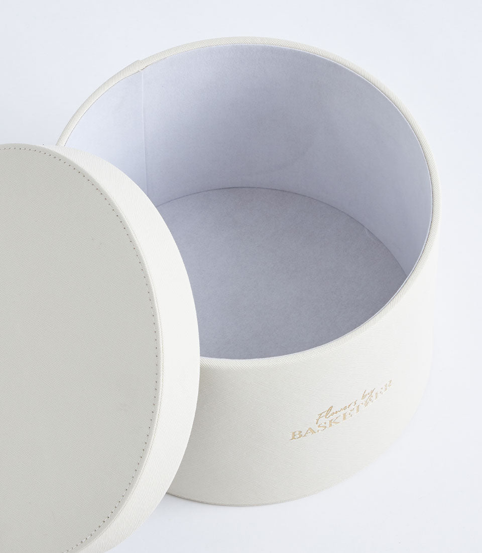 Luxurious Basketeer ivory gift box with textured finish and gold logo,