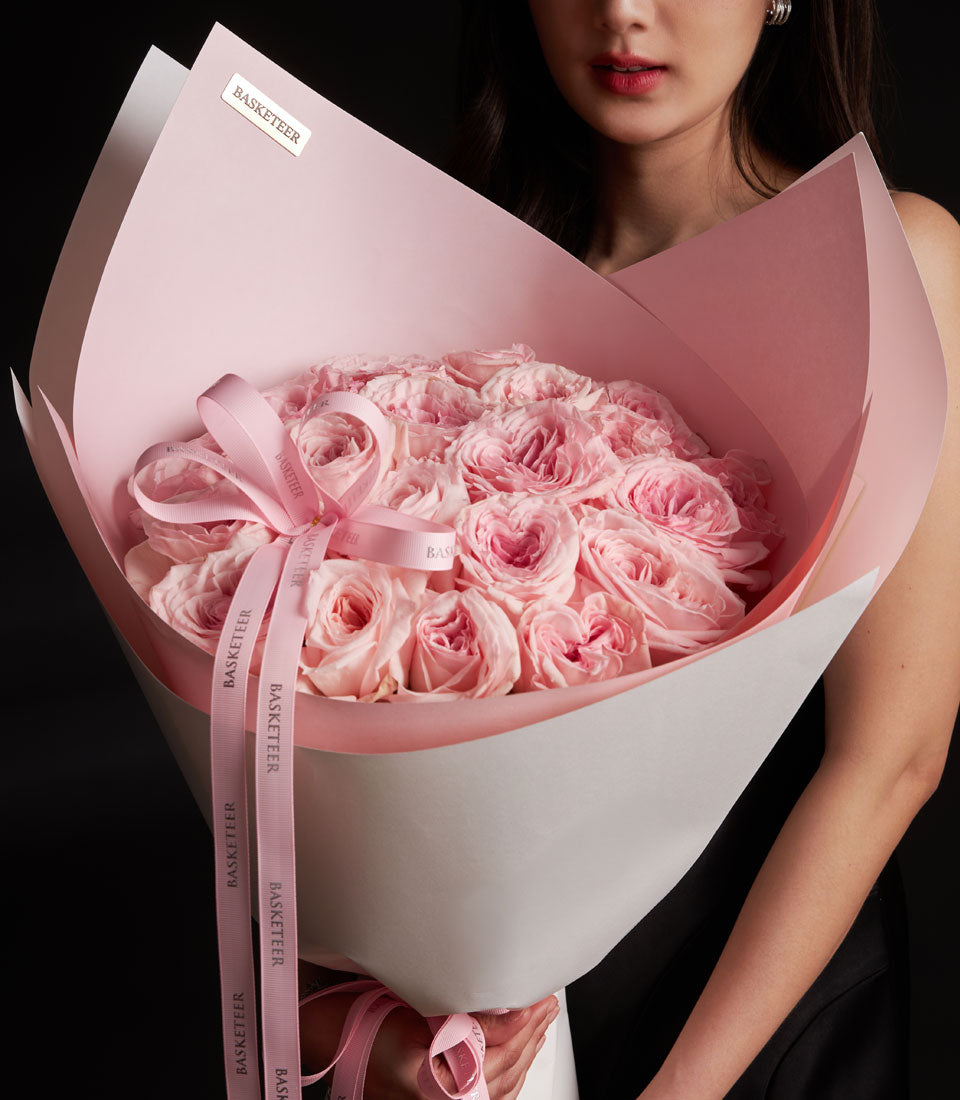 Lush pink O'Hara rose bouquet from Flowers by Basketeer. A premium rose bouquet, beautifully wrapped with pink ribbon, perfect for flower delivery Bangkok.