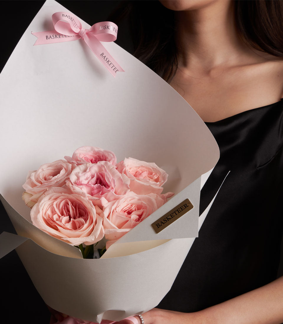 Light pink O-Hara rose bouquet with white paper wrap and pink ribbon, romantic Valentine's Day gift