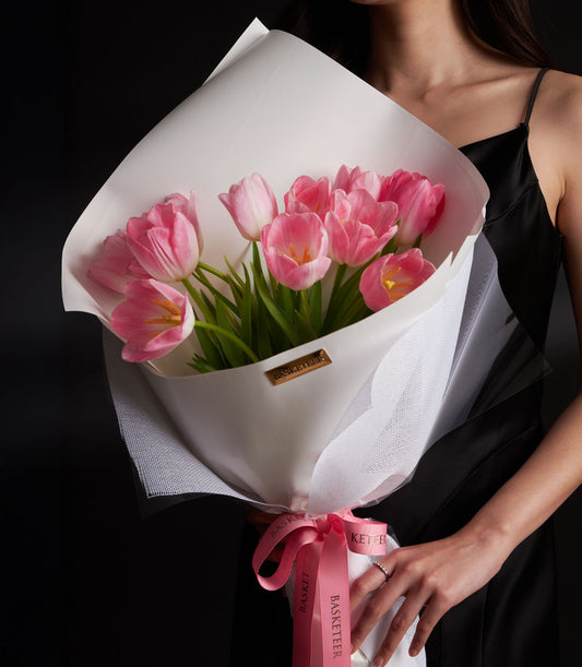 Premium pink tulip Valentine bouquet with white mesh wrapping and pink ribbon
