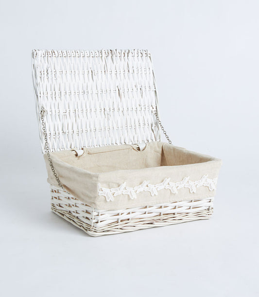 White wicker storage basket with hinged lid and lace-trimmed beige liner