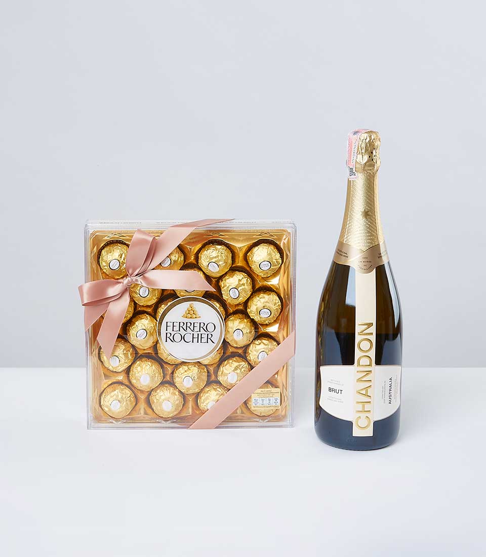 Premium gift set with Ferrero Rocher chocolates and Chandon Brut sparkling wine, tied in pink ribbon