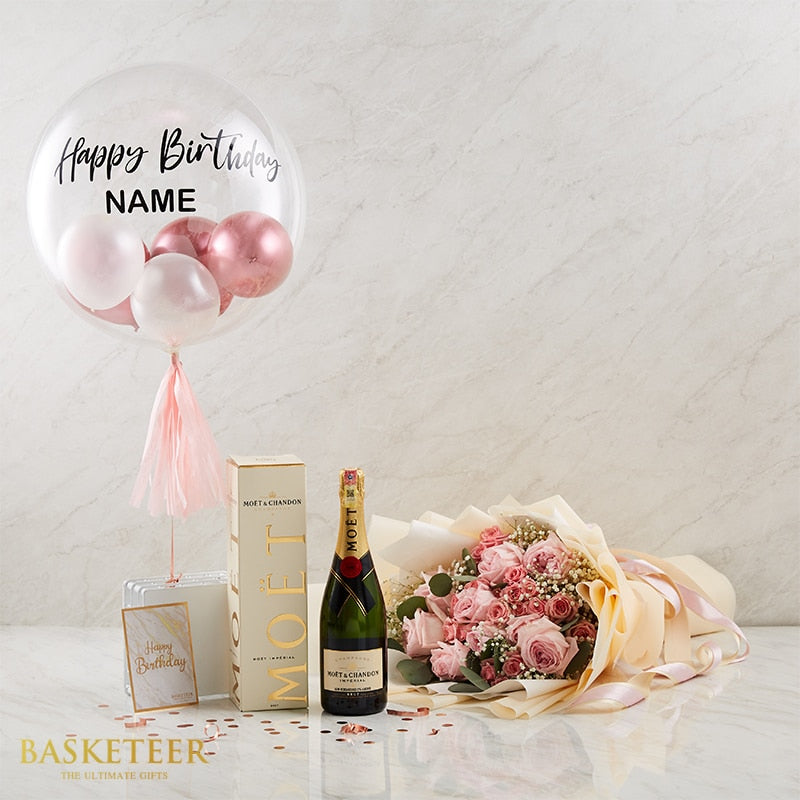 Luxury birthday champagne gift set with pink roses, bubble balloon, and Moët in gold-labeled bottle