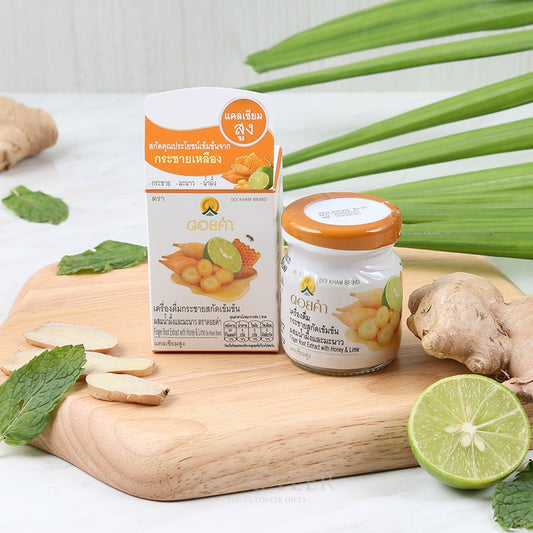 Doi Kham finger root extract with honey and lime in white packaging with fresh ginger and lime ingredients on wooden board
