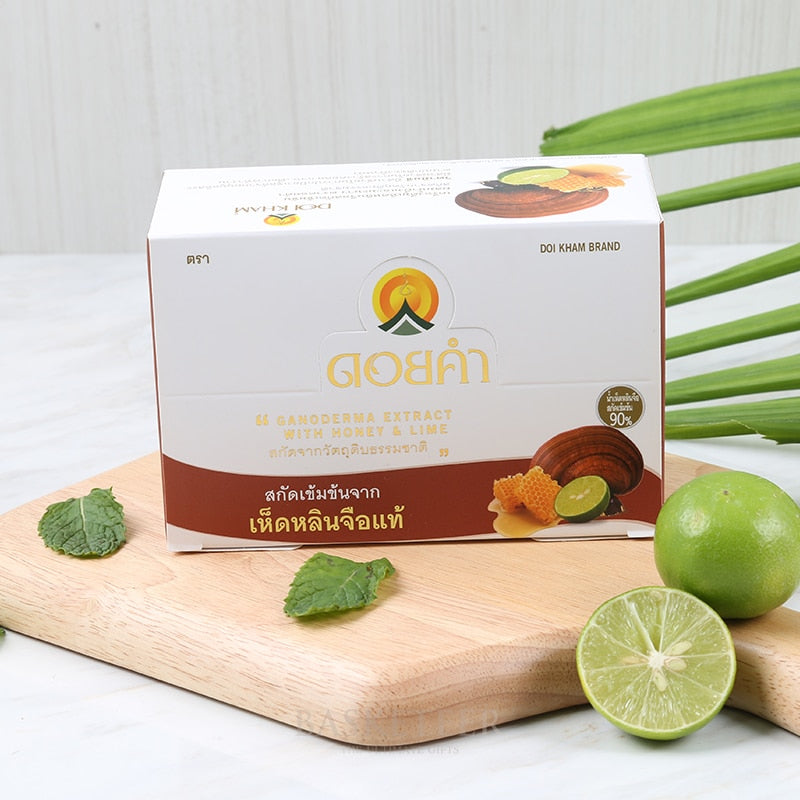 Ganoderma Extract with Honey & Lime wellness gift box with fresh lime and mint on wooden board