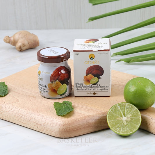 Ganoderma extract with honey and lime health supplement jar and box with natural ingredients on wooden board