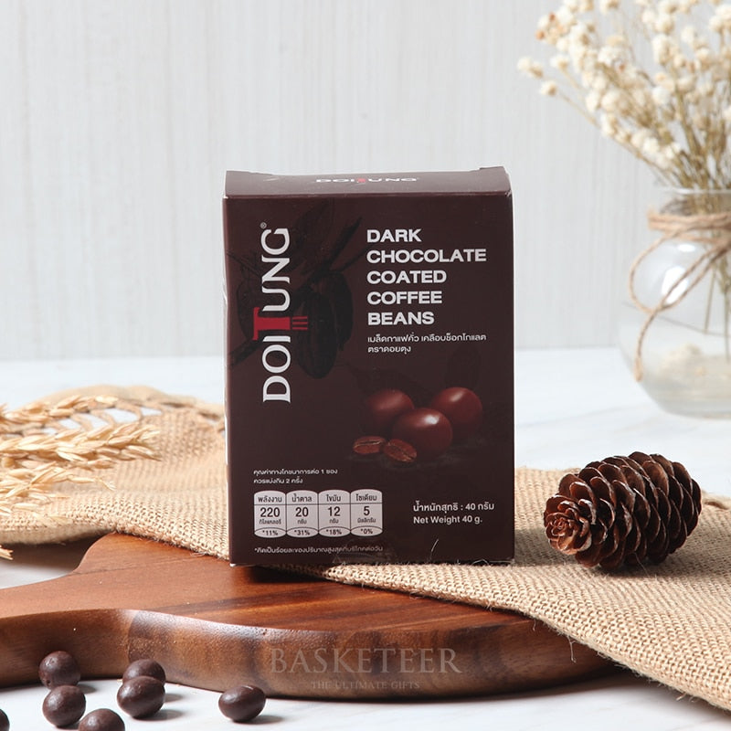 Dark chocolate coated coffee beans in artisan gift box with rustic wooden styling