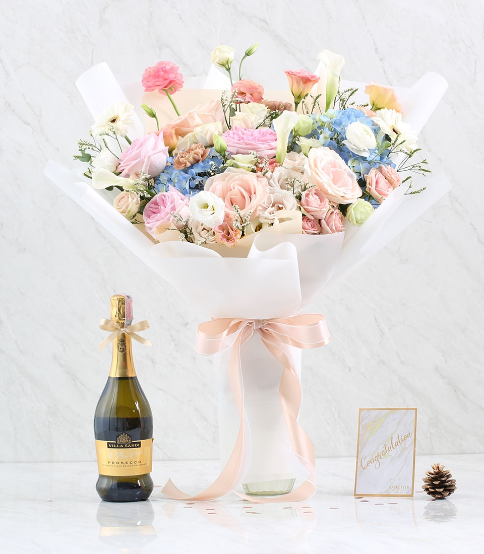 Pastel pink, peach, and white rose bouquet with Prosecco sparkling wine, anniversary celebration gift set