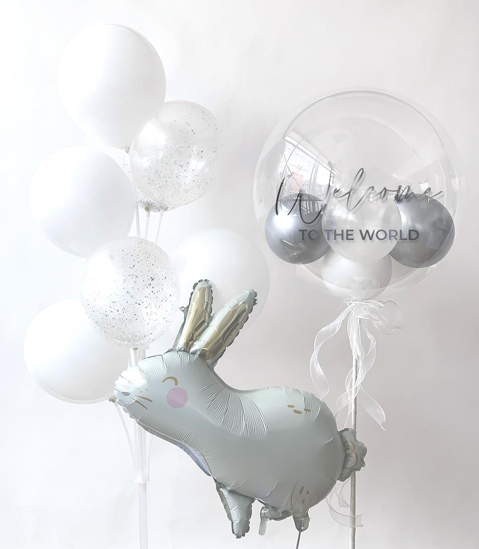 Welcome Baby Bunny balloon bouquet with white latex, silver glitter, and foil rabbit for newborn celebrations