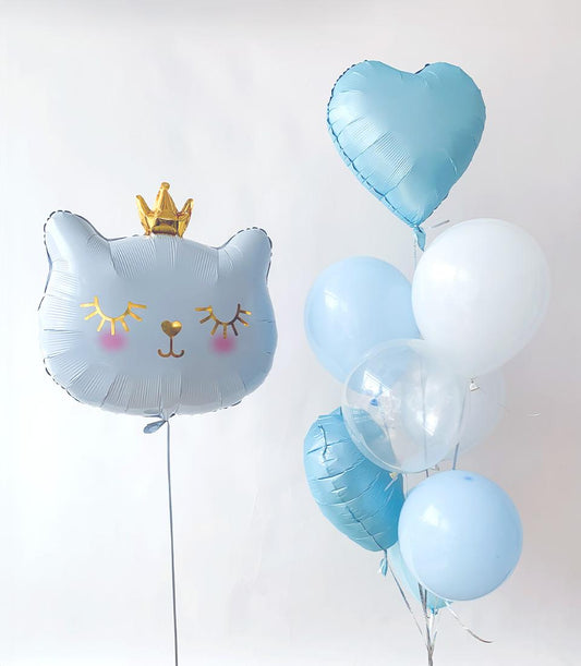 Dreamy cat with golden crown and pastel balloon cluster for kids' birthday celebrations
