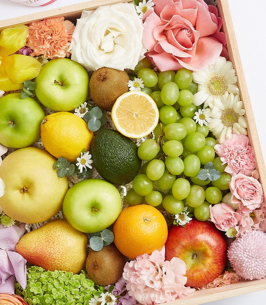 Fresh fruit and flower gift box with apples, pears, citrus, and premium roses in wooden presentation box