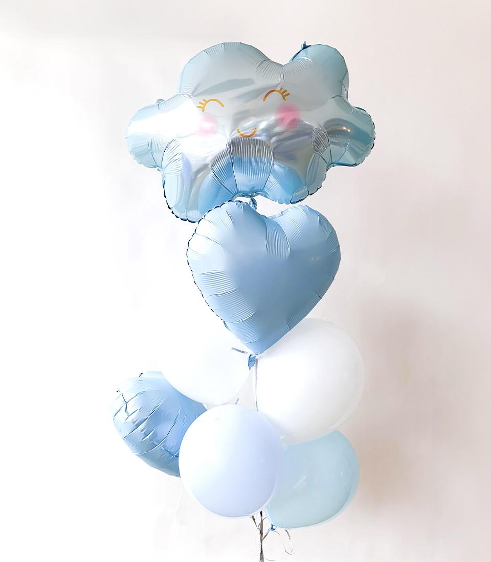 Blue and white balloon bouquet with smiling cloud and heart shapes for kids' birthdays