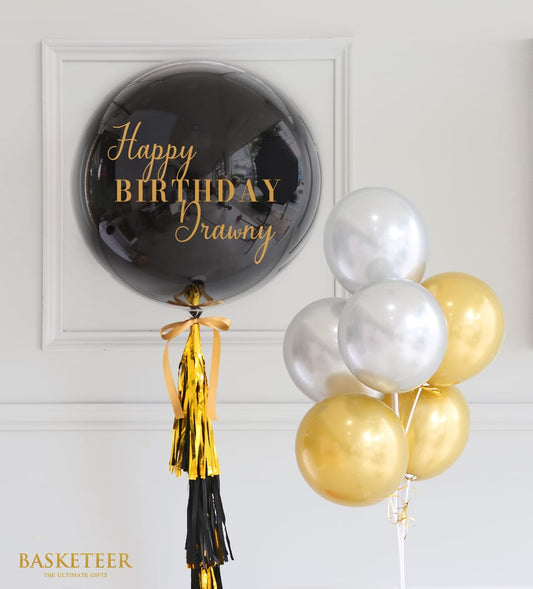 Black and gold Happy Birthday balloon set with metallic tassel garland and silver accent balloons