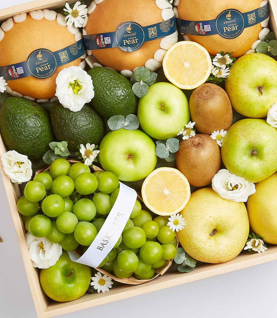 Premium fresh fruit crate with pears, avocados, apples, kiwis and grapes in wooden gift box