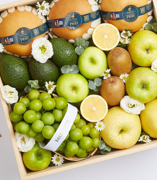 Premium fresh fruit crate with pears, avocados, apples, kiwis and grapes in wooden gift box