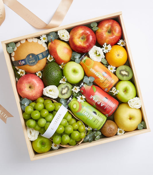 Artisanal wooden gift box with fresh grapes, assorted apples, pears, kiwi and premium fruit juices