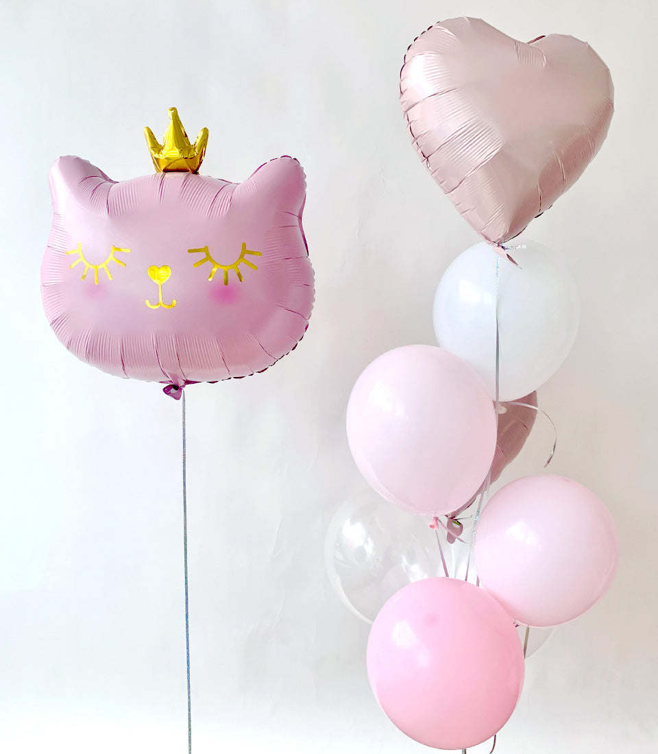 Pink cat balloon with crown and heart-shaped balloon bouquet for kids' birthday celebrations