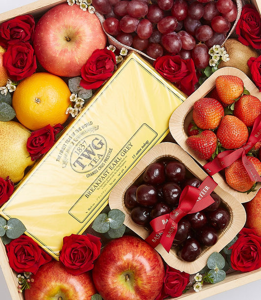 Premium fresh fruit selection with Earl Grey tea, roses, and eucalyptus in luxury gift box
