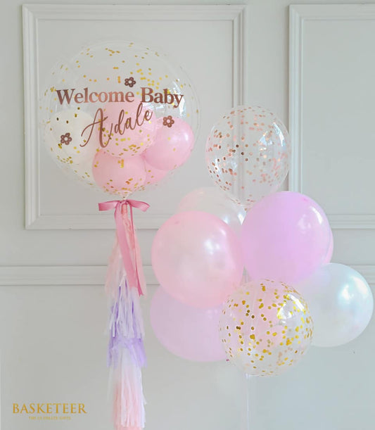 Sweet pink and white bubble balloon set with gold confetti and tassel garland for celebrations