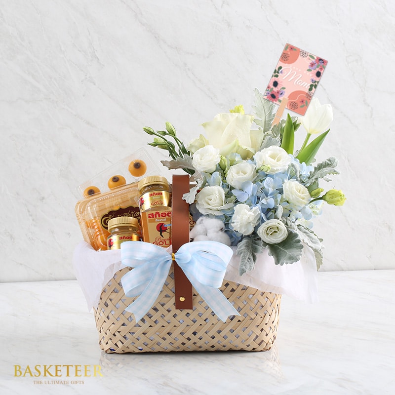 Premium gift basket with white roses, hydrangeas, tulips, Scottish whisky, and artisan Thai desserts for Mother's Day
