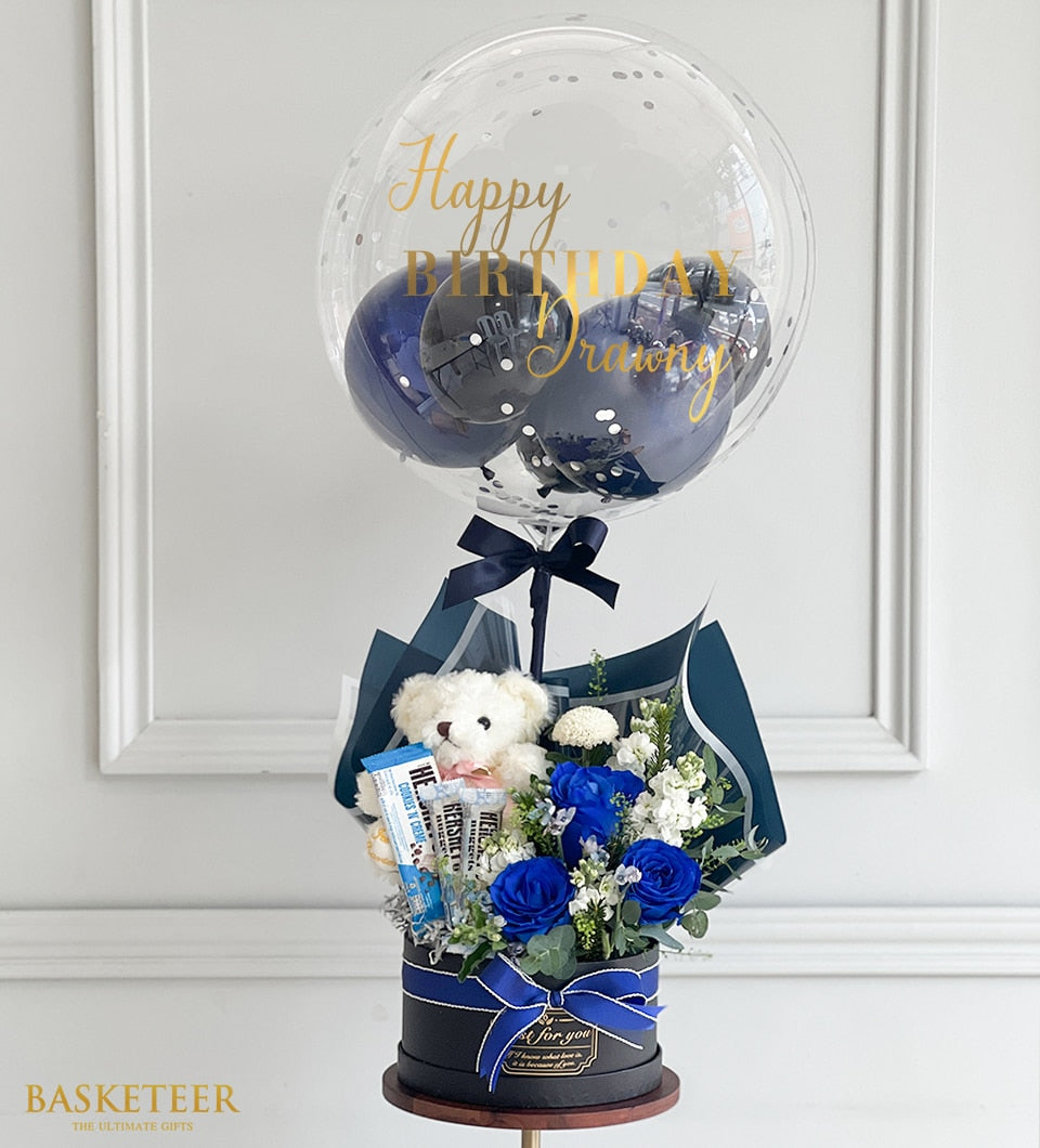 Radiant blue rose bouquet with teddy bear, chocolate, and confetti-filled happy birthday balloon