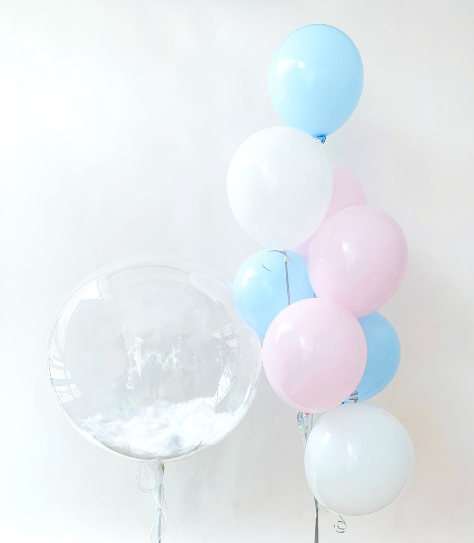 Soft pastel balloon bouquet with fluffy cloud-filled bubble balloon, ideal for baby celebrations and new arrivals