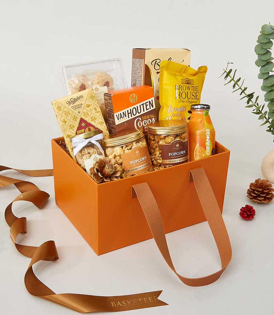 Luxury leather-inspired gift hamper with gourmet chocolates, caramel popcorn, brownies and artisan snacks for New Year