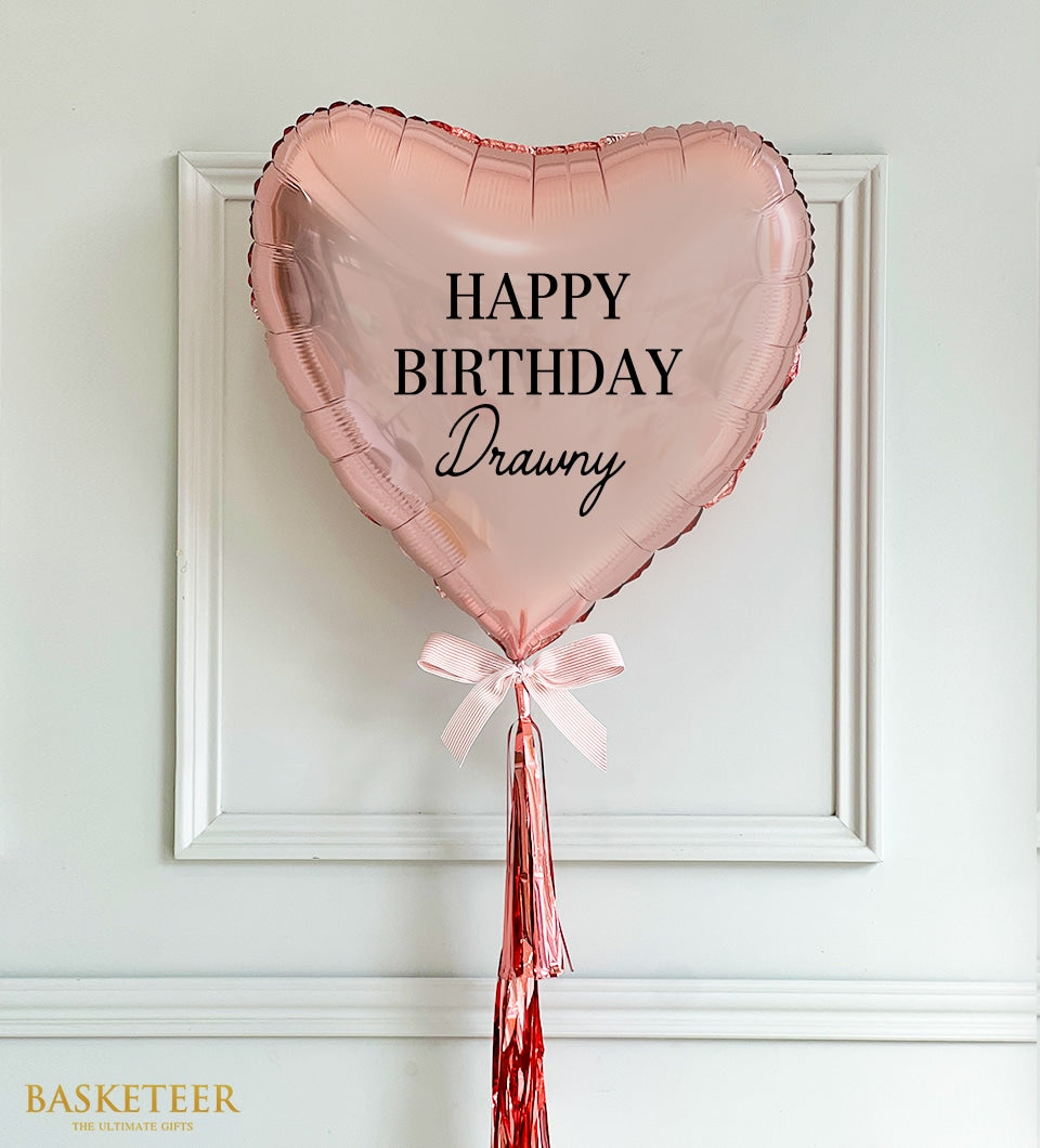 Rose gold foil heart balloon with personalised birthday message and pink striped ribbon bow