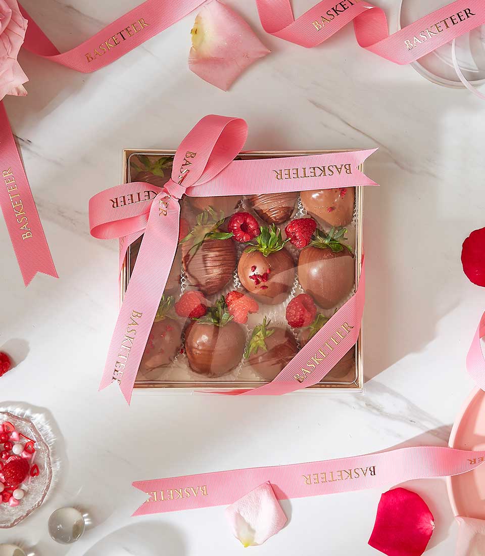Luxury chocolate-covered strawberries gift box with pink ribbon, perfect for Valentine's Day