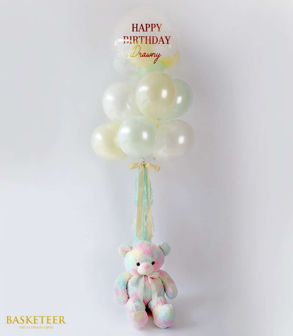 Pastel balloon bouquet with "Happy Birthday" clear balloon and plush teddy bear gift set