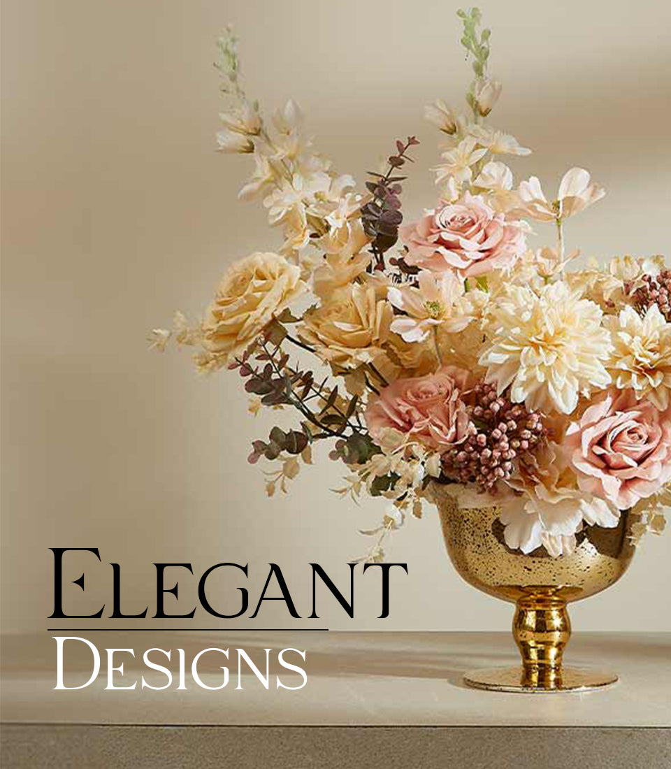 Luxury peach and blush rose arrangement in speckled gold vase with white dahlias and eucalyptus