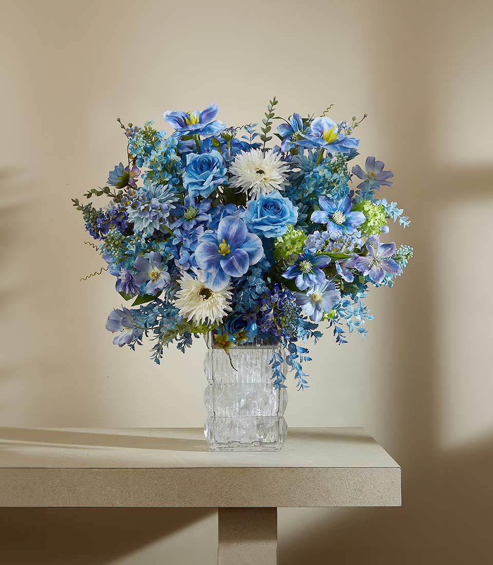 Blue and white artificial flower arrangement in textured glass vase, luxury floral gift