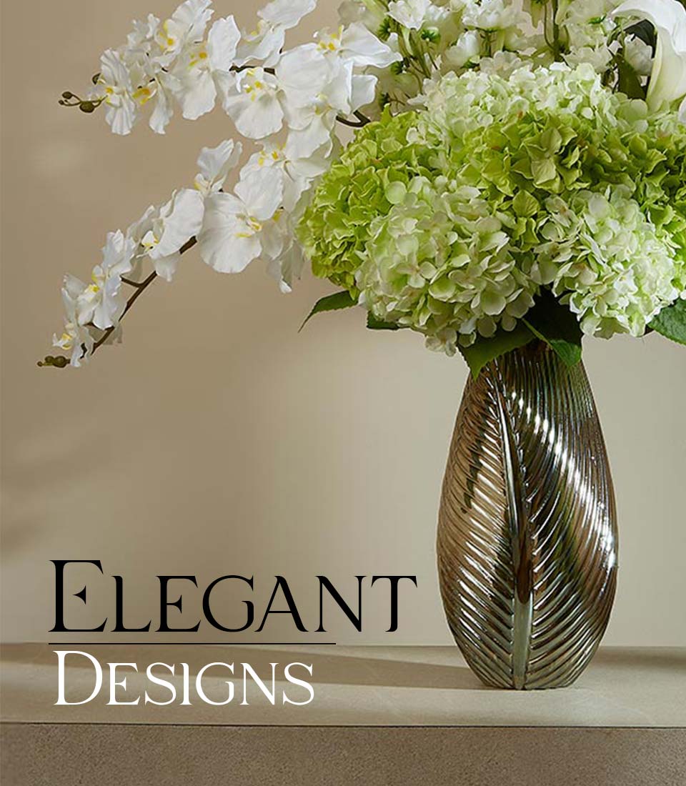 White orchids and soft green hydrangeas in bronze leaf-textured vase, elegant artificial flower arrangement