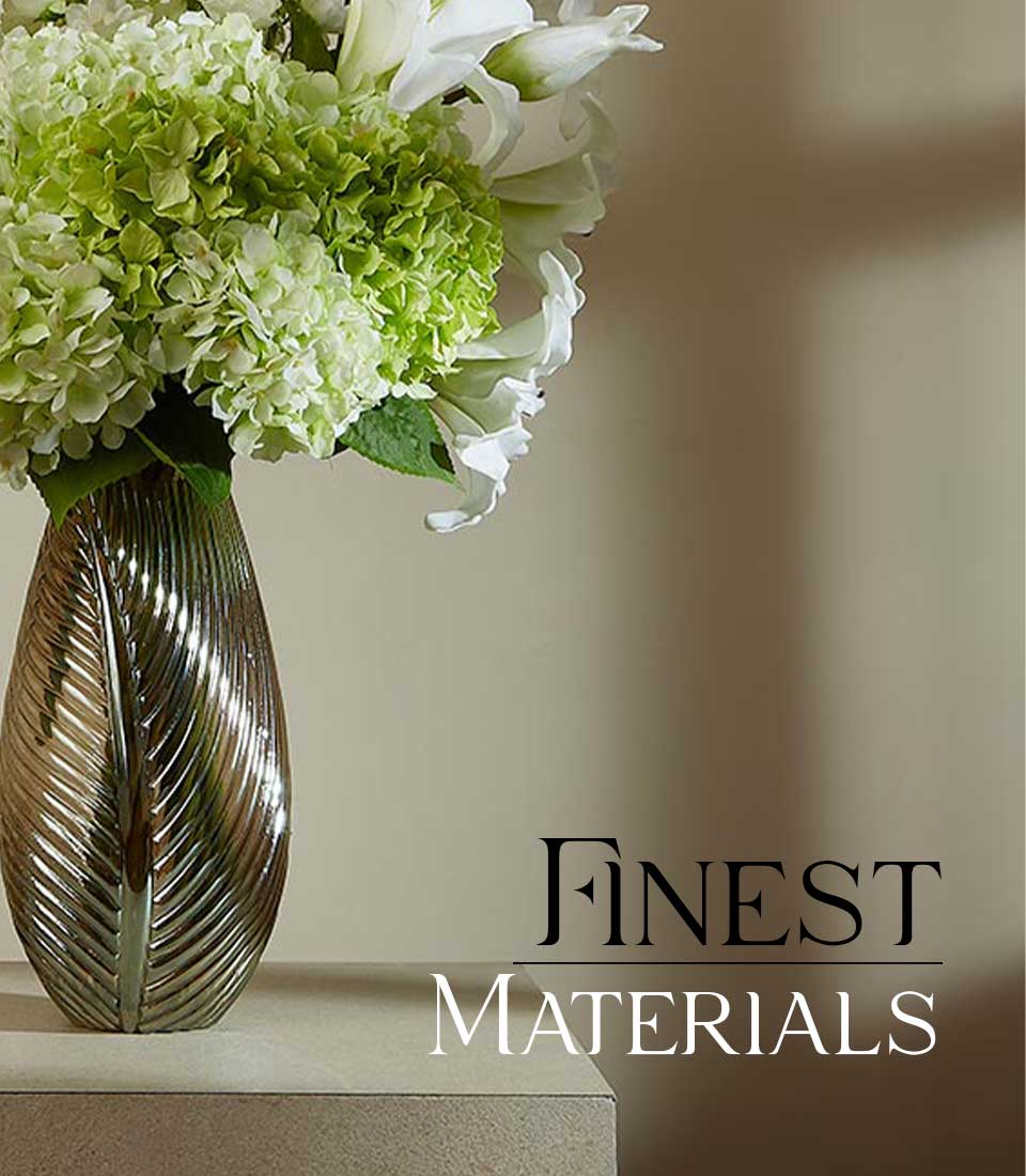 Artificial hydrangea and calla lily bouquet in bronze metallic leaf-textured vase