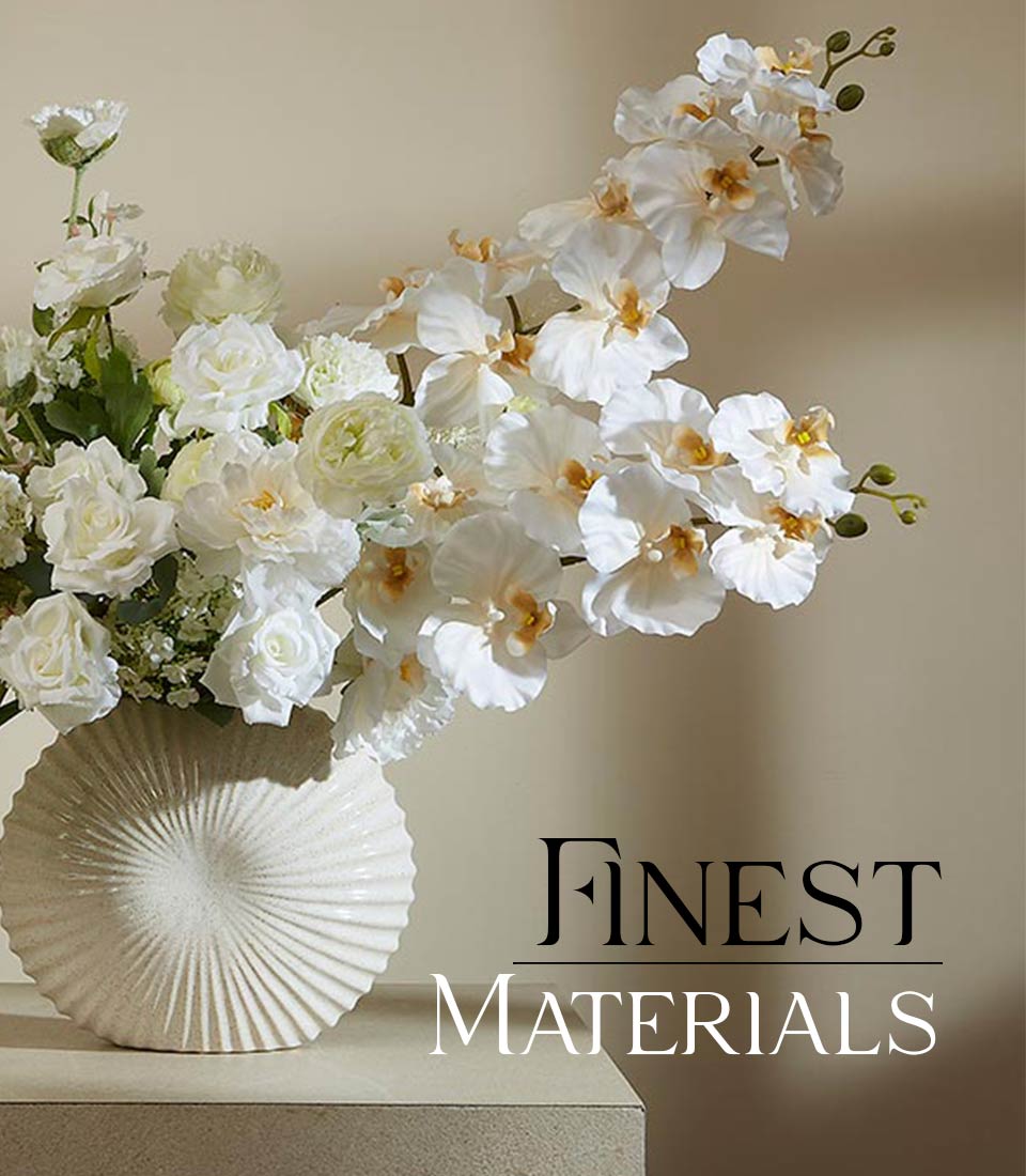 White roses and orchids in textured ceramic vase, sophisticated frosted arrangement for gifting
