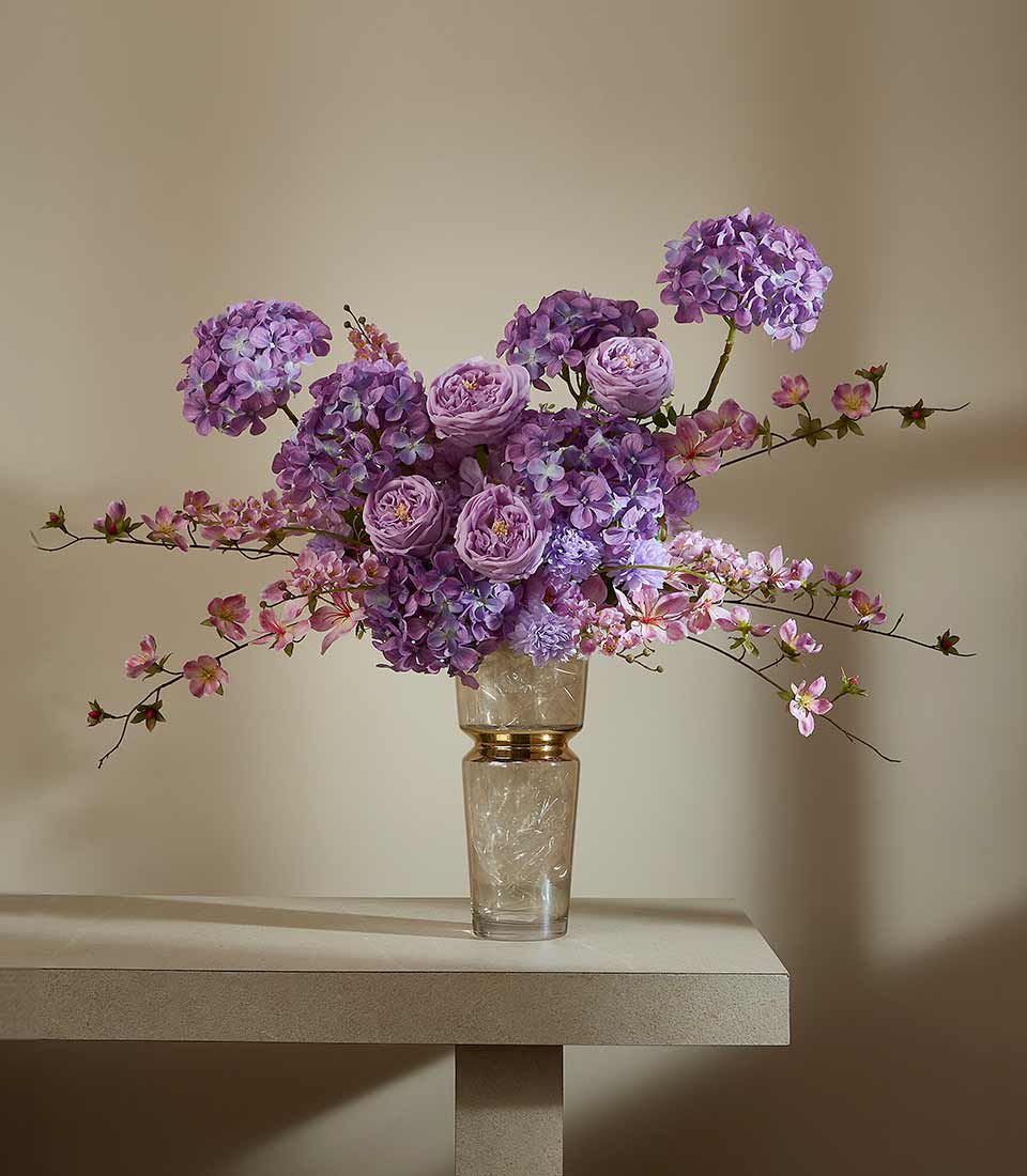 Purple and pink hydrangea and rose arrangement in gold-accented glass vase, elegant artificial flower gift