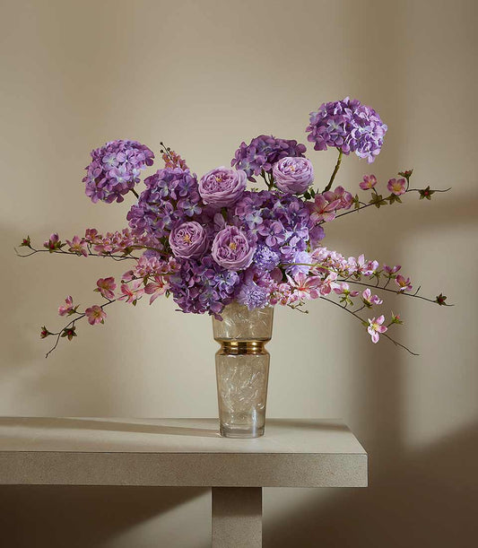 Purple and pink hydrangea and rose arrangement in gold-accented glass vase, elegant artificial flower gift
