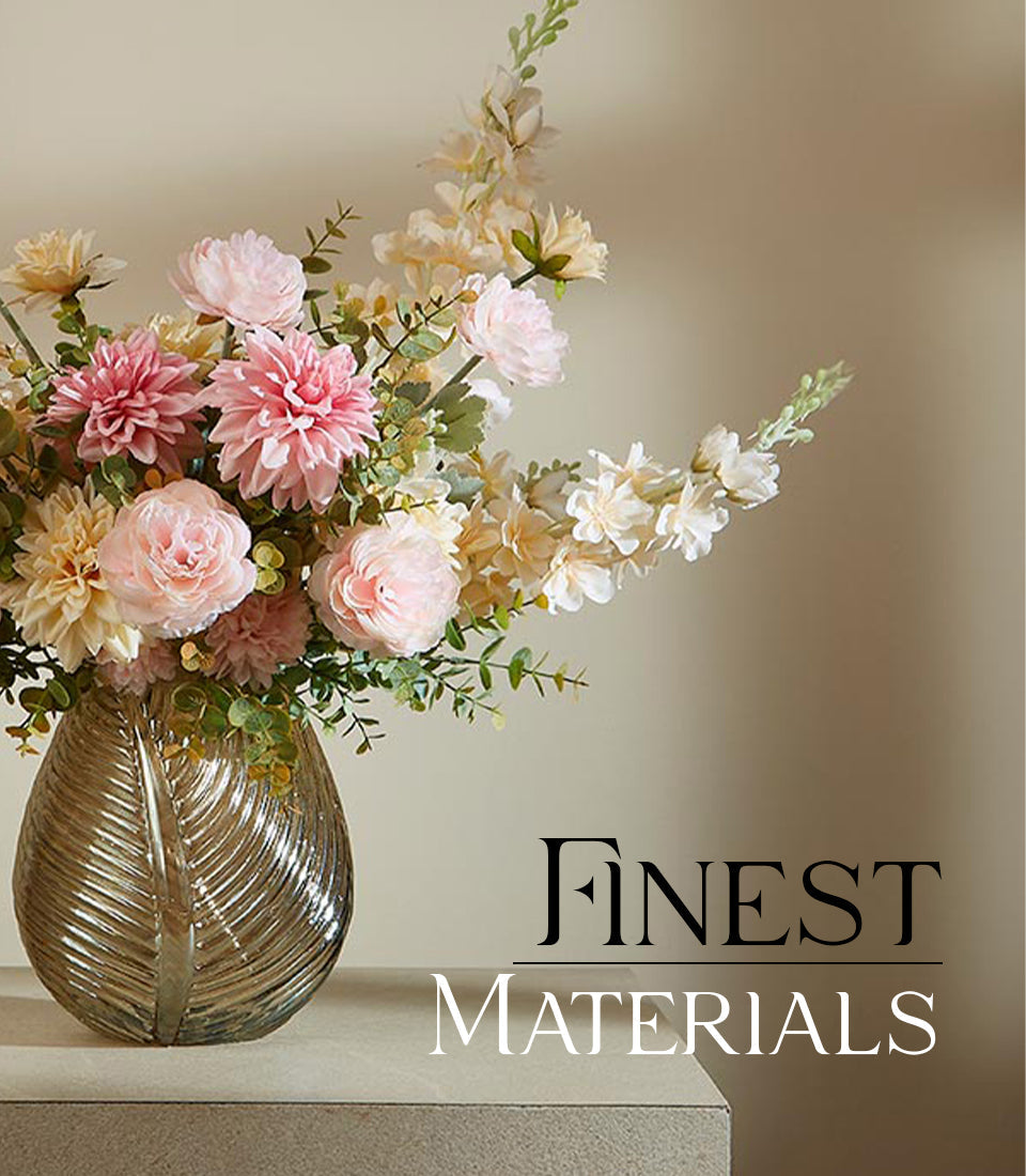 Sophisticated Charm artificial flower arrangement in textured glass vase with pale pink, cream, and yellow blooms