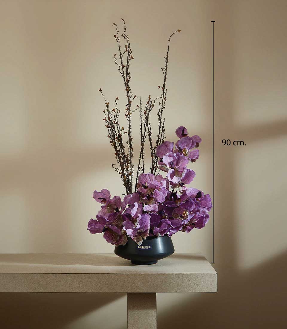 Purple artificial orchids with dried branches in sleek matte black vase, 90 cm tall luxury floral gift arrangement
