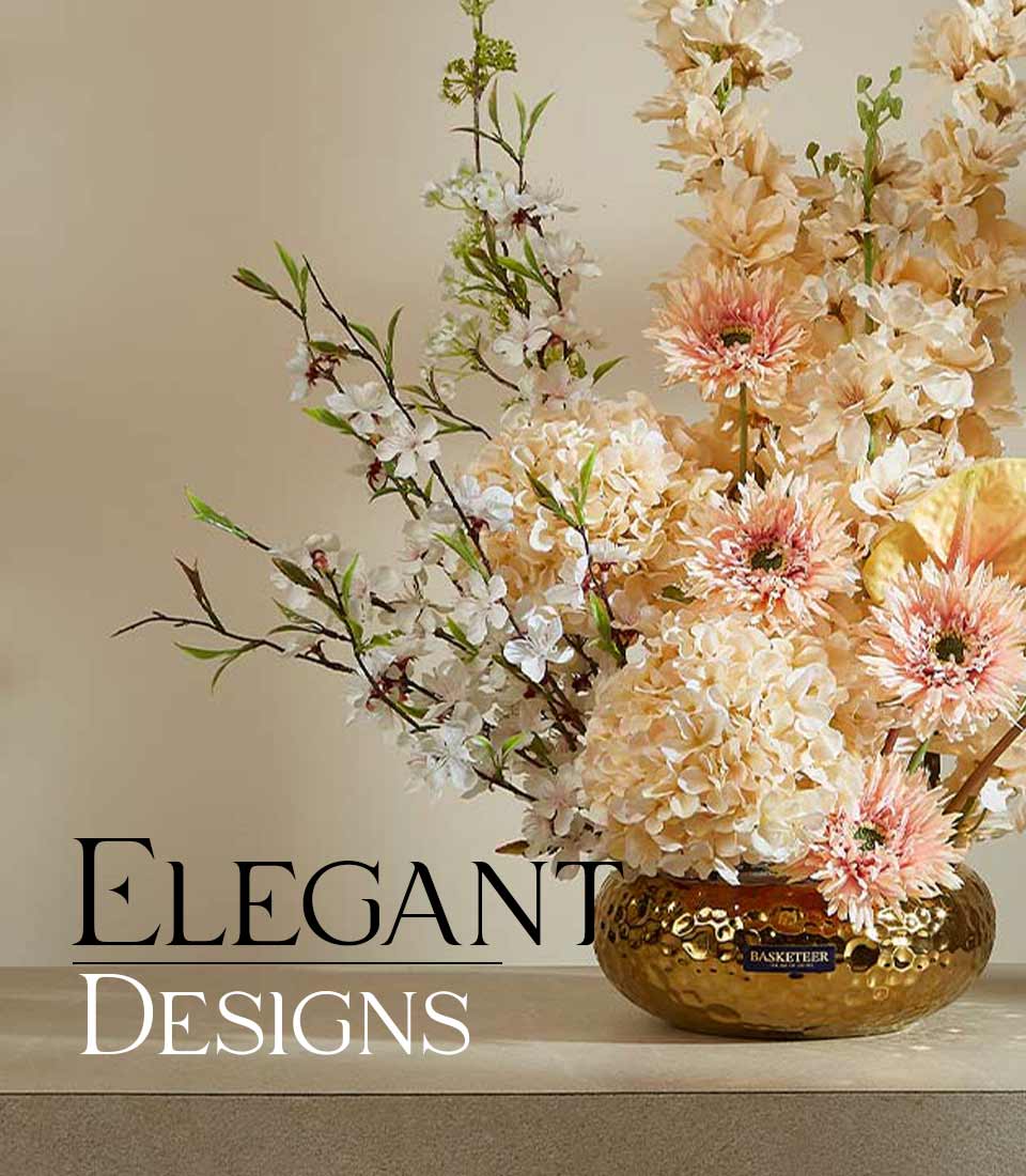 Luxury artificial flower arrangement with white blossoms, peach hydrangeas, and pink gerberas in hammered gold vase
