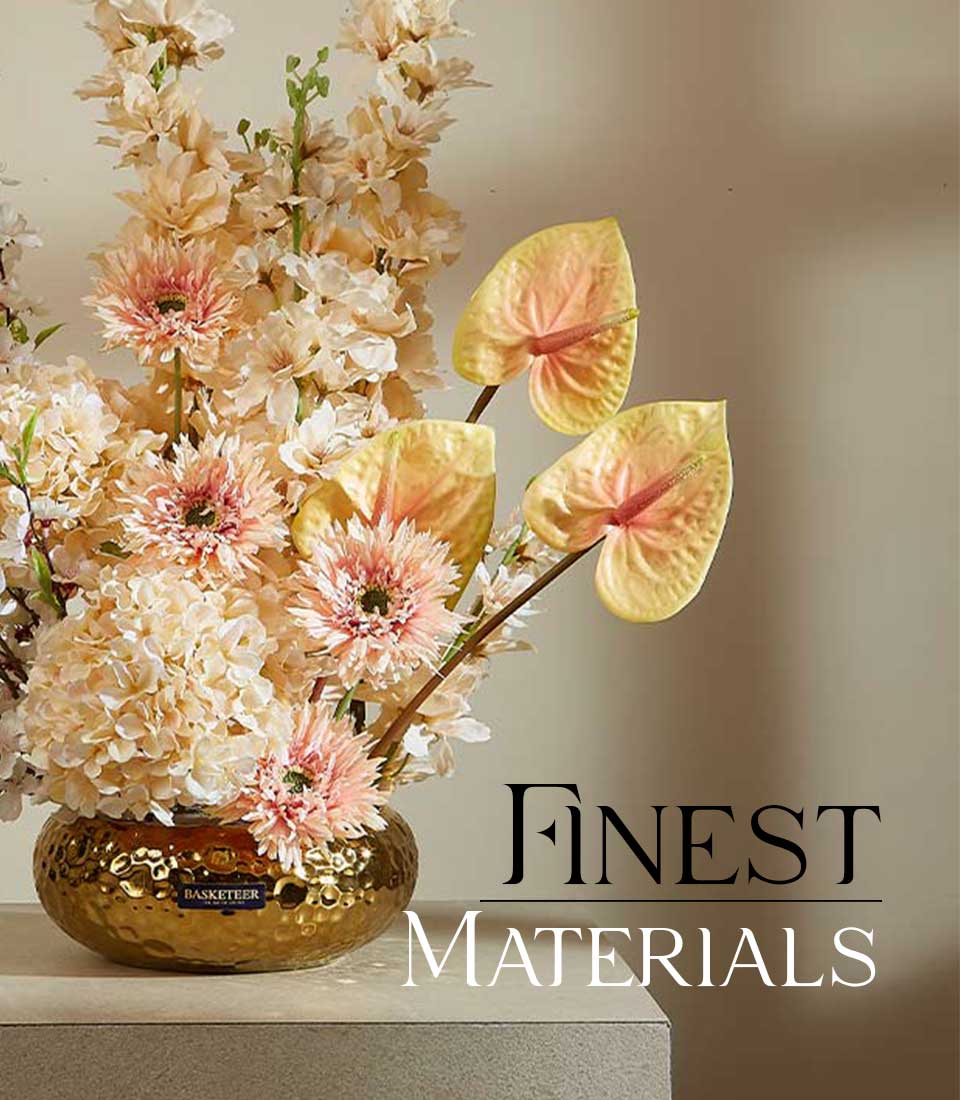 Luxurious peach and cream hydrangea arrangement with gold hammered vase and anthurium accents